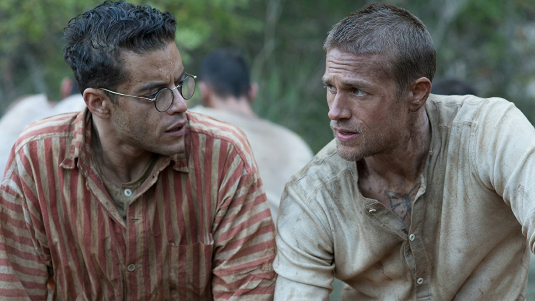 27 сентября в российских кинотеатрах появится фильм «Мотылек» от режиссера Михаэля Ноэра. Это экранизация одноименного биографического романа Анри Шарьера, опубликованного в 1969 году. Роман однажды уже был экранизирован — в 1973 году, где роль самого Анри Шарьера исполнил американец Стив Маккуин. Мне удалось посмотреть новую версию «Мотылька» до выхода в российский прокат на пресс-показе, и в этом материале я расскажу о своих впечатлениях.